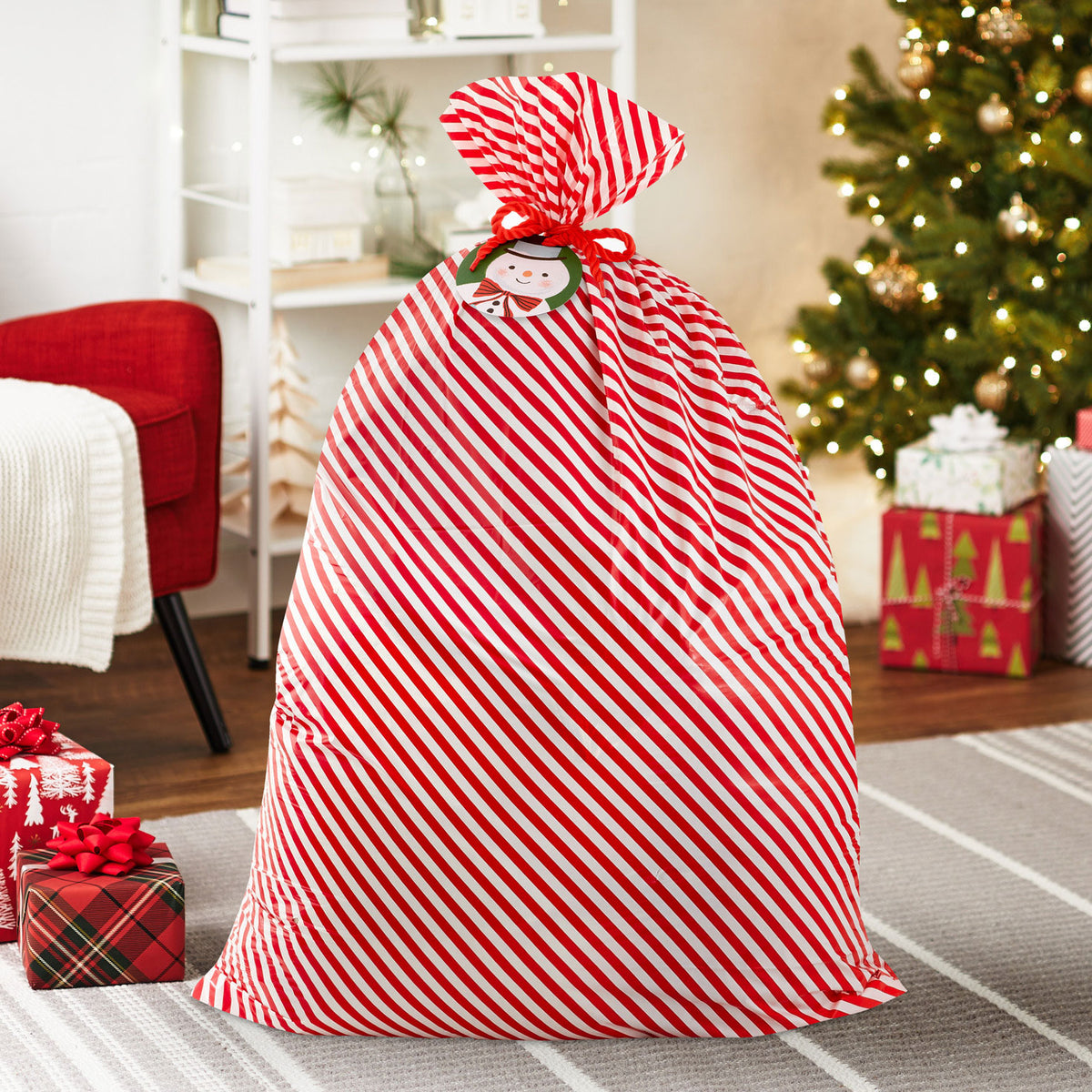 Hallmark 56'' Red and White Striped Giant Plastic Christmas Gift Bag With Snowman Tag and Tie