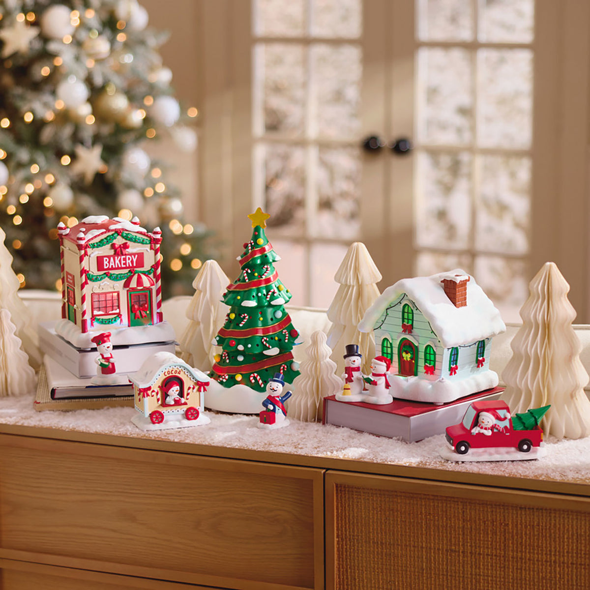Hallmark Magic Snowman Village Musical Christmas House and Carolers Tabletop Decorations With Light, Set of 2
