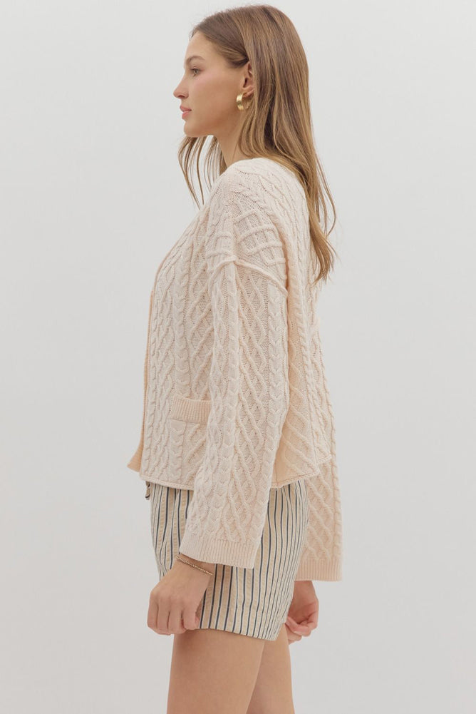 Solid Cropped Cable Knit Cardigan in Ecru by Entro